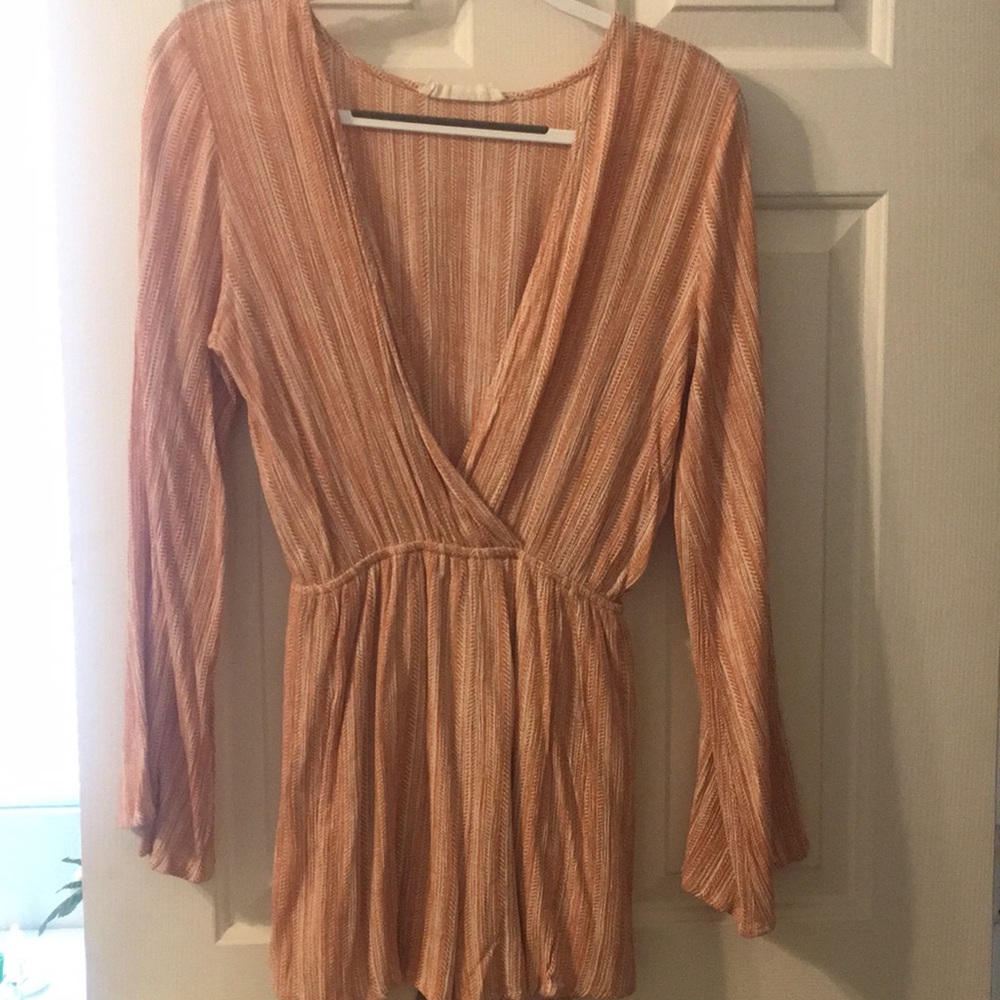 Audrey styled long-sleeve orange romper